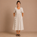 Dames gestreepte midi-jurk met zakken en knoopdetails Jelle Jora Mode
