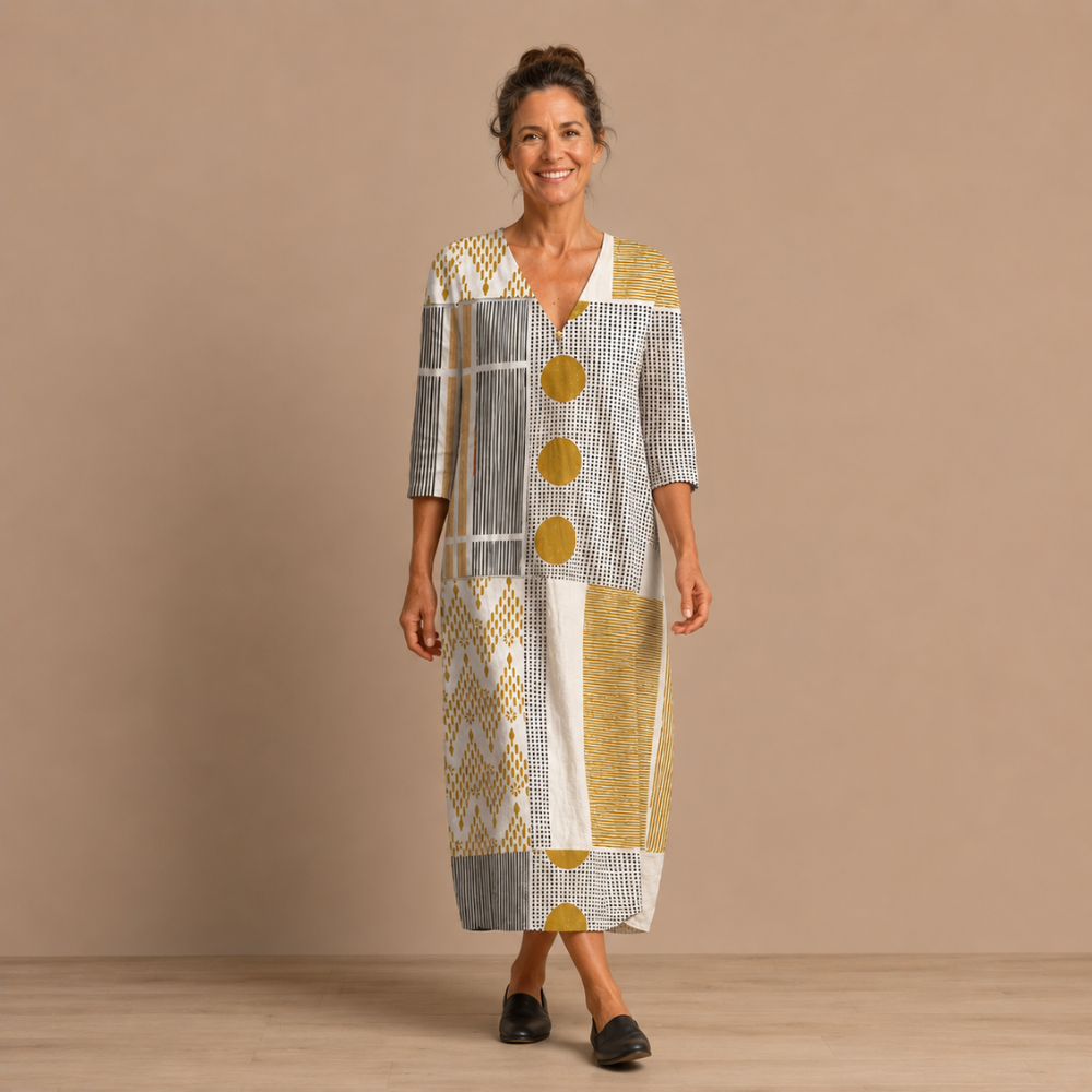 Dames maxijurk met artistiek ontwerp en V-hals Jelle Jora Mode